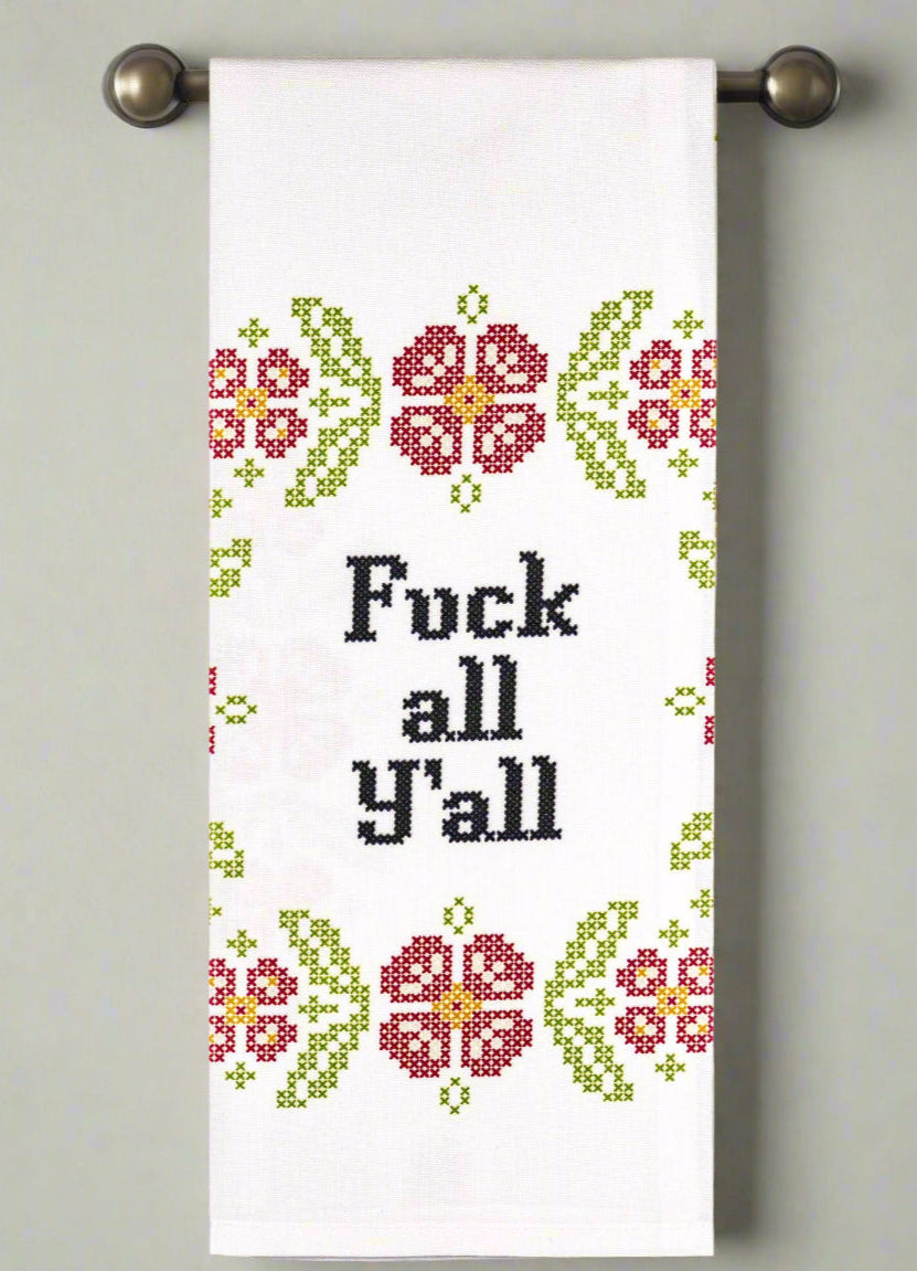 Towel with floral pattern and text on a gray background