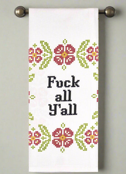 Towel with floral pattern and text on a gray background